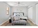 Beautiful bedroom featuring wood floors, chaise lounge, ceiling fan and ample natural light at 13227 N Mimosa Dr # 101, Fountain Hills, AZ 85268