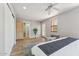 Bright bedroom boasting wood floors, ceiling fan, closet with sliding doors and outdoor access at 13227 N Mimosa Dr # 101, Fountain Hills, AZ 85268