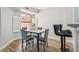 Cozy dining area featuring a modern table set and counter seating area with bar stools at 13227 N Mimosa Dr # 101, Fountain Hills, AZ 85268