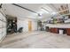 Spacious garage featuring ample storage, an epoxy floor, and bright lighting at 13227 N Mimosa Dr # 101, Fountain Hills, AZ 85268