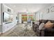 Bright living room with hardwood floors, a view to the outside, and a comfortable sofa at 13227 N Mimosa Dr # 101, Fountain Hills, AZ 85268