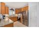Well-equipped kitchen with granite countertops, stainless steel appliances, tile backsplash, and ample cabinet space at 14000 N 94Th N St # 1129, Scottsdale, AZ 85260