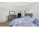 Bright bedroom with blue accents, complete with a queen bed and dresser at 14000 N 94Th N St # 1129, Scottsdale, AZ 85260
