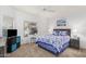 Well-lit bedroom with a queen bed, writing desk, and neutral carpet at 14000 N 94Th N St # 1129, Scottsdale, AZ 85260