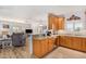 Open kitchen flows into a comfortable living area, featuring granite countertops, and stainless steel appliances at 14000 N 94Th N St # 1129, Scottsdale, AZ 85260