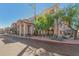 Beautiful condo exterior featuring desert landscaping, clean architecture, mature trees, and well-maintained grounds at 14000 N 94Th N St # 1129, Scottsdale, AZ 85260