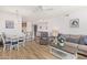 Bright and airy living space featuring open concept design, modern decor, wood-look floors, and a breakfast bar at 14000 N 94Th N St # 1129, Scottsdale, AZ 85260