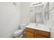 Bright bathroom with a toilet, sink, and large mirror, creating a functional and clean space at 14000 N 94Th St # 3198, Scottsdale, AZ 85260
