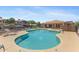 Large, inviting community pool surrounded by lounge chairs and well-maintained landscaping at 14000 N 94Th St # 3198, Scottsdale, AZ 85260
