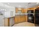 Well-lit kitchen featuring modern appliances and ample countertop space for meal preparation and cooking at 14000 N 94Th St # 3198, Scottsdale, AZ 85260