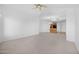 Inviting space with neutral carpeting, providing an open view into the kitchen area with a breakfast bar at 14000 N 94Th St # 3198, Scottsdale, AZ 85260