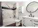 Bathroom featuring a shower over the bath and a single sink vanity at 14235 N 26Th Ln, Phoenix, AZ 85023