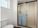 Modern bathroom features a glass-enclosed shower with a rainfall shower head at 14235 N 26Th Ln, Phoenix, AZ 85023