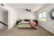 Bright bedroom with neutral carpet, a ceiling fan, and a window offering natural light at 14235 N 26Th Ln, Phoenix, AZ 85023