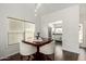 Cozy dining room with a modern light fixture, and natural light, adjacent to the kitchen at 14235 N 26Th Ln, Phoenix, AZ 85023