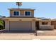 Charming two-story home featuring an attached garage, solar panels, and well-maintained landscaping at 14235 N 26Th Ln, Phoenix, AZ 85023