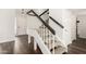 Interior view of the carpeted staircase, and dark wood handrail leading to the upper level of the home at 14235 N 26Th Ln, Phoenix, AZ 85023