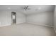 Large bedroom with carpet, ceiling fan, and neutral paint at 15634 W Georgia Dr, Surprise, AZ 85379