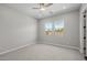 A minimalist bedroom featuring neutral walls and plush carpeting at 15634 W Georgia Dr, Surprise, AZ 85379