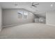 Spacious bonus room with neutral walls, carpet, and views to the outside at 15634 W Georgia Dr, Surprise, AZ 85379