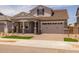 Attractive two-story home with a well-maintained lawn and a neutral color scheme at 15634 W Georgia Dr, Surprise, AZ 85379