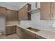 Close up of a kitchen showcasing sleek countertops, ample cabinetry and stainless steel appliances at 15634 W Georgia Dr, Surprise, AZ 85379