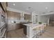 Spacious kitchen with island seating, stainless appliances, and modern cabinetry at 15634 W Georgia Dr, Surprise, AZ 85379