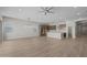 Open concept living room with wood floors, recessed lighting, and access to the kitchen at 15634 W Georgia Dr, Surprise, AZ 85379