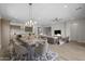 Open-concept living area with dining table and modern furnishings at 15634 W Georgia Dr, Surprise, AZ 85379