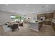 Open-concept living area with modern furnishings, natural light, and backyard views at 15634 W Georgia Dr, Surprise, AZ 85379