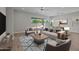Stylish living room featuring a modern furniture arrangement and a neutral color palette at 15634 W Georgia Dr, Surprise, AZ 85379
