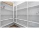 Spacious pantry features ample shelving for organized storage at 15634 W Georgia Dr, Surprise, AZ 85379