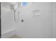 Clean, spacious shower with built-in seat and modern fixtures at 15634 W Georgia Dr, Surprise, AZ 85379