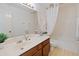 Bright bathroom with a shower-tub combo and a wooden vanity at 1606 N Apache Dr, Chandler, AZ 85244