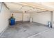 Spacious garage interior with painted walls and concrete floor at 1606 N Apache Dr, Chandler, AZ 85244