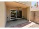 A covered patio with a ceiling fan, providing a cool outdoor space with convenient access to the interior at 1606 N Apache Dr, Chandler, AZ 85244