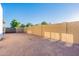 Large empty backyard space enclosed with a tall brick wall offers plenty of room for custom landscaping and various design opportunities at 16602 N 66Th St, Scottsdale, AZ 85254