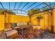 Comfortable outdoor lounge area with couches, chairs, tables, covered pergola and an inviting carpet at 16602 N 66Th St, Scottsdale, AZ 85254
