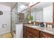 Bathroom features a large vanity and a frameless glass shower with multiple shower heads at 16602 N 66Th St, Scottsdale, AZ 85254