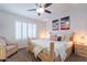 Comfortable bedroom with wooden bed frame, plantation shutters and modern lighting at 16602 N 66Th St, Scottsdale, AZ 85254