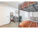 Bedroom with a bunk bed, a desk, a chair, and a window with plantation shutters at 16602 N 66Th St, Scottsdale, AZ 85254