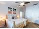 Bright bedroom featuring natural wood furniture, unique artwork, and neutral tones at 16602 N 66Th St, Scottsdale, AZ 85254