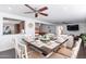 Spacious dining area flows into the kitchen, featuring a large table set for eight at 16602 N 66Th St, Scottsdale, AZ 85254
