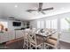 Open-concept dining and living area with neutral color palette and dark wood floors at 16602 N 66Th St, Scottsdale, AZ 85254