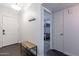 Inviting entryway featuring tile floors, a coat rack and access to a bedroom at 16602 N 66Th St, Scottsdale, AZ 85254