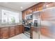 Gourmet kitchen with stainless steel appliances and sleek granite countertops at 16602 N 66Th St, Scottsdale, AZ 85254
