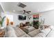 Inviting living room with fireplace, large sectional sofa and views to the entryway at 16602 N 66Th St, Scottsdale, AZ 85254