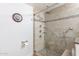 Bathroom features a walk-in shower with multiple shower heads and a built-in bench at 16602 N 66Th St, Scottsdale, AZ 85254