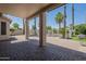 Covered back patio overlooking a fenced-in pool with lush landscaping and palm trees at 1826 W Oriole Way, Chandler, AZ 85286