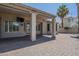 Covered back patio featuring a brick floor, large support columns, and a wall mounted TV at 1826 W Oriole Way, Chandler, AZ 85286